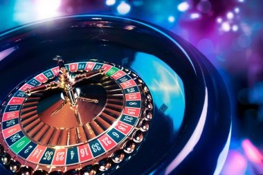 Live dealer rolling three dice in studio